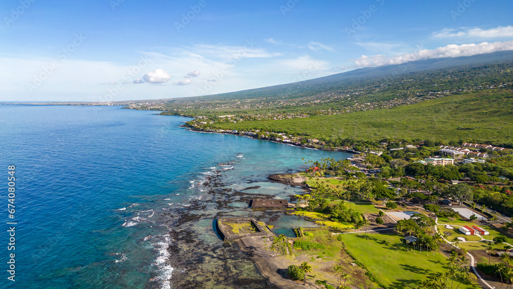 Drone photos off the the Big Island, Hawaii along the coast line with a beautiful blue sky and water