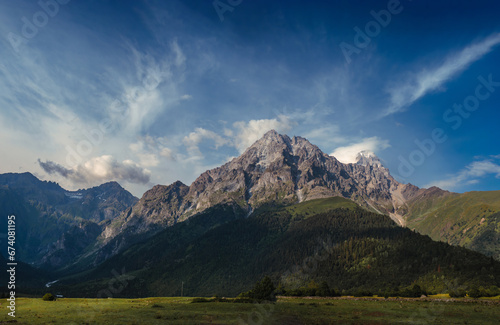 Panorama with high resolution. View of mount Ushba, from Mazeri, Georgia. Summer day, blue sky, sunset time. Mountains, nature landscape. Travel and hiking concept