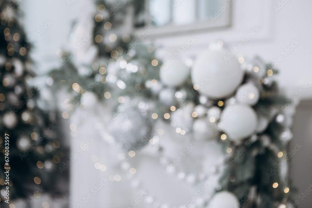 Defocused blur cozy flat apartment photo studio room green Christmas Tree gifts presents garlands, candles white decorated toys balls interior New Year lights glowing bokeh
