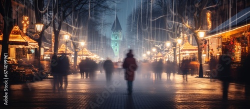 Streets of the Christmas city in the evening. Long exposure. Motion blur. Abstract Christmas background. © Restyler