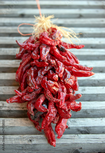 Drying Red Chili Peppers with gray background in Espanola New Mexico United States