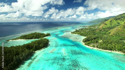 Drone Tahiti.  Aerial Moorea island, French Polynesia. Crystal clear water blue lagoon. Exotic travel vacation getaway, romantic honeymoon destination. Famous tourism destination.  photo