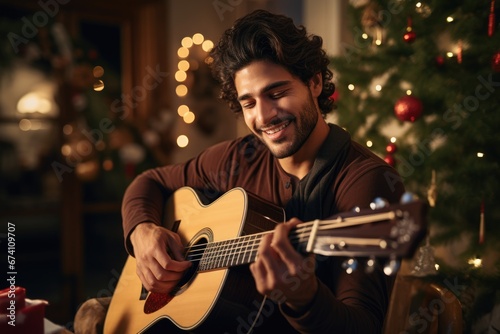 A young man playing a tune on a classical guitar during a holiday gathering, evoking the cultural diversity and artistry of festive celebrations.