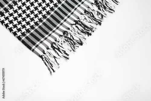 Keffiyeh or Pushi, head covering commonly used in the Middle East and the Arab World. Keffiyeh is a traditional garment tied to the head.