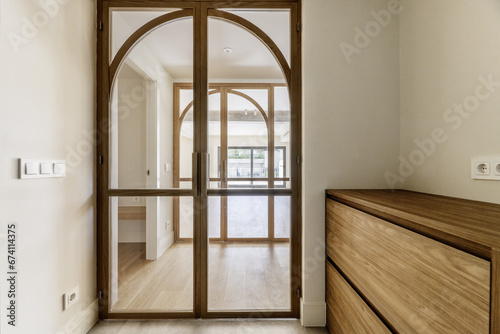 Double glass doors leading to a lounge with access to a terrace