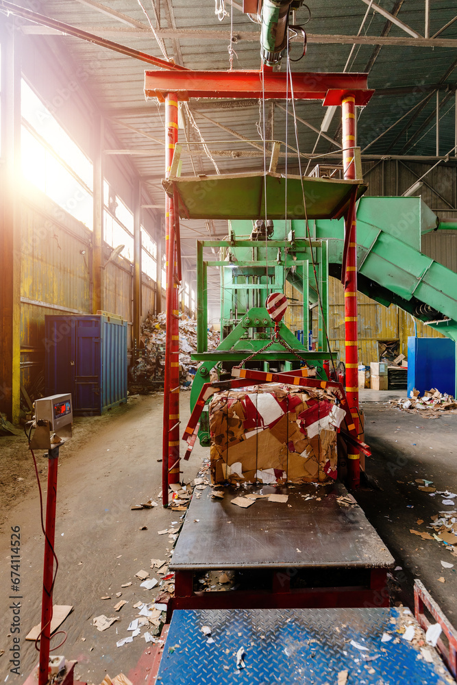 Pressing and baling of wastepaper in recycling factory