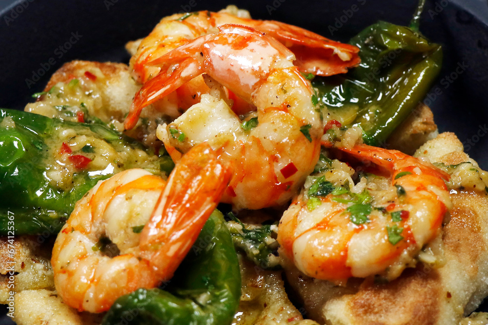 butter and chili garlic saute prawns or shrimps in close up, mediterranean cuisine butter and chili garlic saute prawns or shrimps in close up, mediterranean cuisine