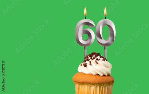 Birthday card with candle number 60 - Cupcake on green background