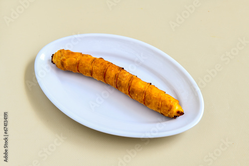 Turkish style meat stuffed filo dough borek served kol boregi. Cheese and minced pie are sliced on a marble background. Turkish name: Kol Boregi, ispanakli, kiymali, Su Boregi