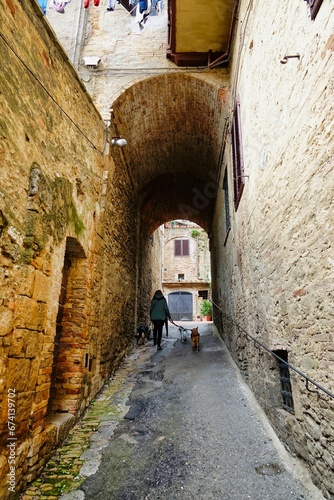 narrow street in the town , image taken in san gimignano, tuscany, italy