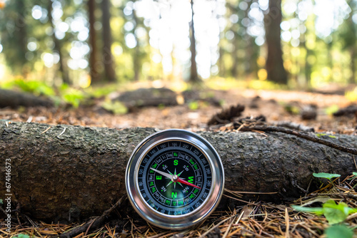 Compass in the autumn forest
