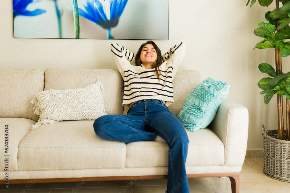 Cozy latin woman enjoying her relaxing leisure time at home Cozy latin woman enjoying her relaxing leisure time at home