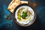 Middle Eastern dip for breakfast with labneh yogurt cream cheese olive oil and zaatar View from above with space for text