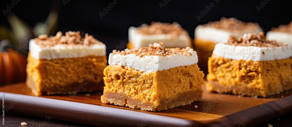 Pumpkin squares featuring a cream cheese icing with a focused view Pumpkin squares featuring a cream cheese icing with a focused view