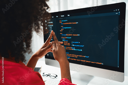 African American woman\'s programing developer. Coding Software project on computer screen server at home office. Concept of website designer in coder network information at work space. Tastemaker.