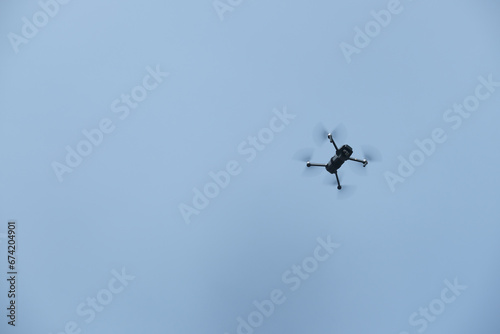 a mini drone flying in the sky