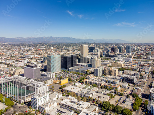 Wallpaper Mural Los Angeles, California – October 30, 2023: aerial drone view toward Wilshire Blvd at LA Koreatown with bank buildings, apartments, houses, and LA Downtown at sunny day  Torontodigital.ca