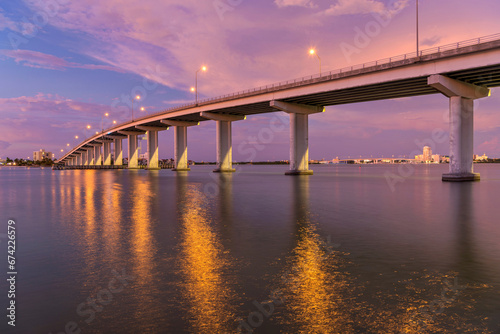 Sand Key Bridge - A panoramic dusk view of Sand Key Bridge, a girder bridge connecting Clearwater and Belleair Beach over the Clearwater Pass, Florida, USA. photo