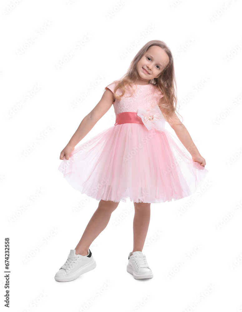 Cute little girl in beautiful dress dancing on white background