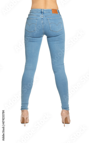 Woman wearing stylish light blue jeans and high heels shoes on white background, closeup