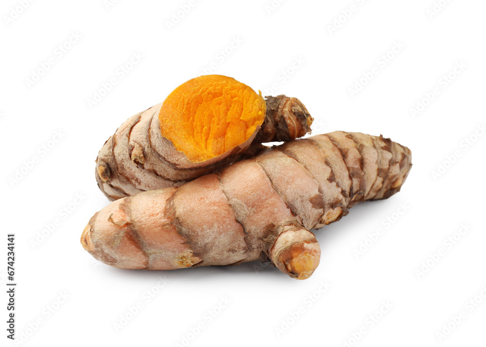 Whole and cut turmeric roots isolated on white Whole and cut turmeric roots isolated on white