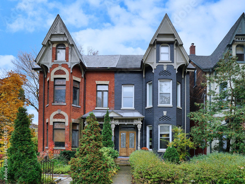 Old narrow Victorian semi-detached houses with gables © Spiroview Inc.
