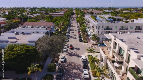 Aerial view of 5th avenue in downtown Naples Florida, with Gulf of Mexico view in the distance and luxury residences and businesses along the avenue. photo