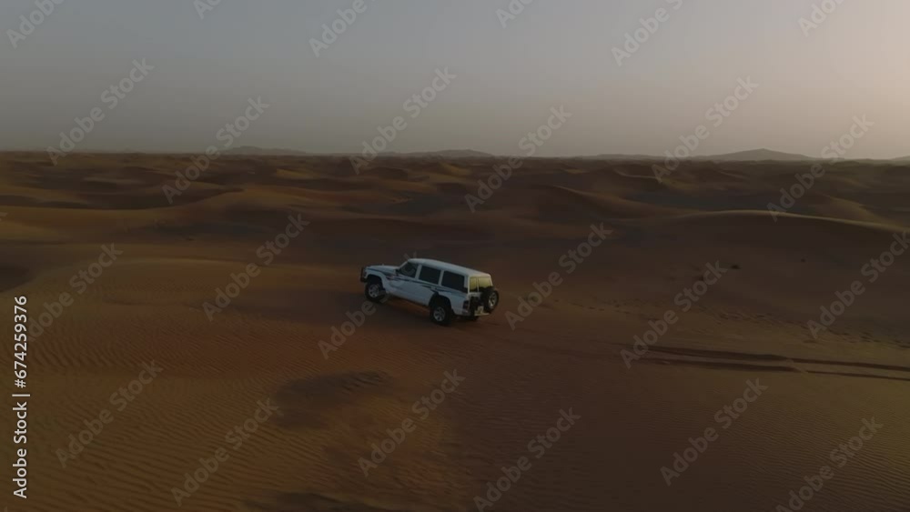 Aerial video on a jeep during a sand dune desert safari, Dubai Aerial video on a jeep during a sand dune desert safari, Dubai
