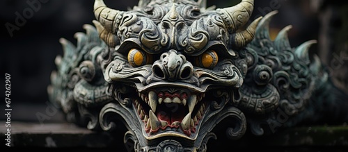 A demon statue from Bali temple in Seminyak portraying a traditional Hindu figure photo