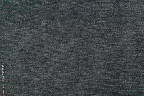 The background is made of black denim material.