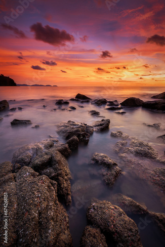Tranquil sunset over rocky coastal landscape, reflecting beauty in nature at Pulau Sayak Kuala Muda Kedah Malaysia
