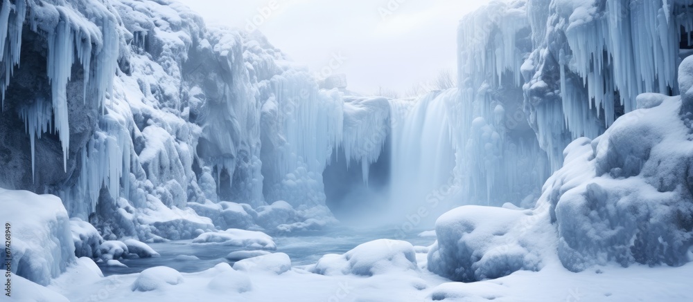 A frozen waterfall during the winter that is not completely solidified A frozen waterfall during the winter that is not completely solidified