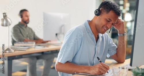 Man, consultant and call center writing notes in telemarketing for customer support or advice at the office. Male consulting agent in contact us with headset on computer for online assistance or help photo