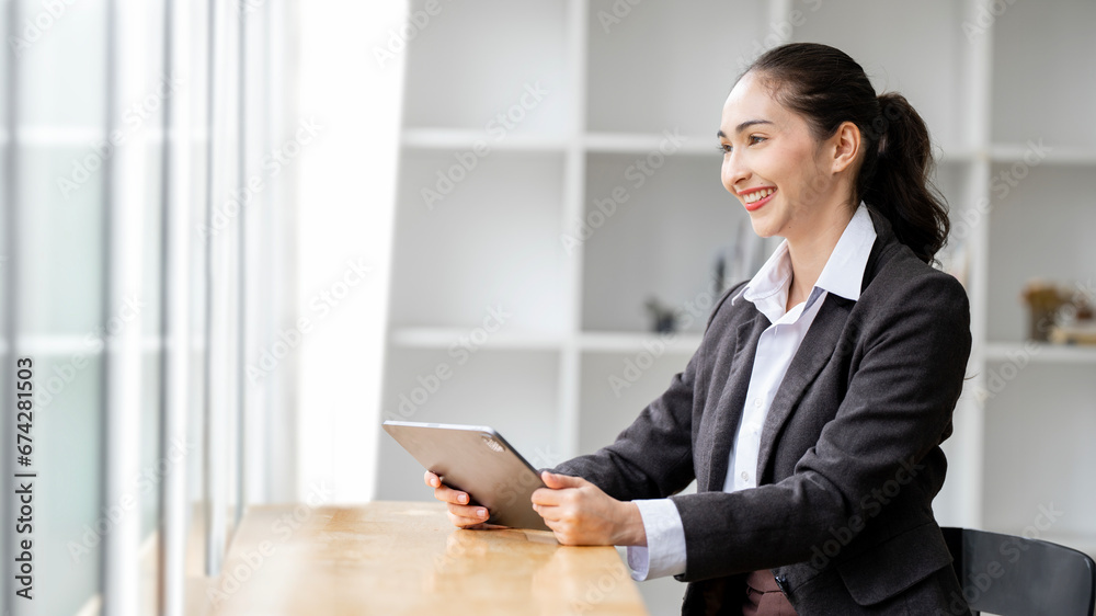 Creative business woman using digital tablet in loft office Creative business woman using digital tablet in loft office