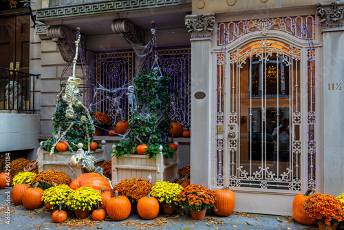 Colorful Pumpkins and Flowers on the Stairs of an Old Brownstone Home in New York City during Autumn. High quality photo