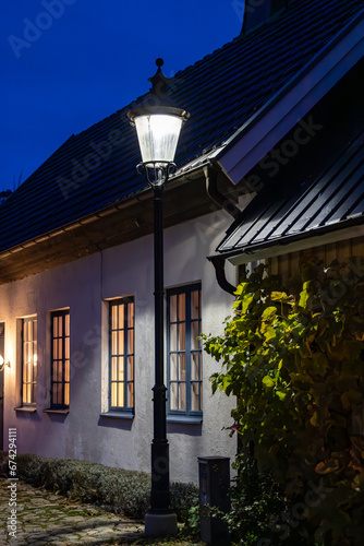 Bastad, Sweden Houses at night on the landmark and picturesque Agardhsgatan with street lamps. photo