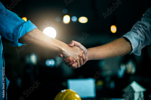 Architect worker team hand shaking after successful consultation meeting agreement plan new project contract in office at construction site, teamwork, partnership and contractor concept with client