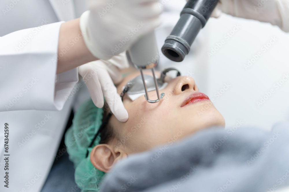 Woman receiving pico laser facial treatment in beauty Clinic.