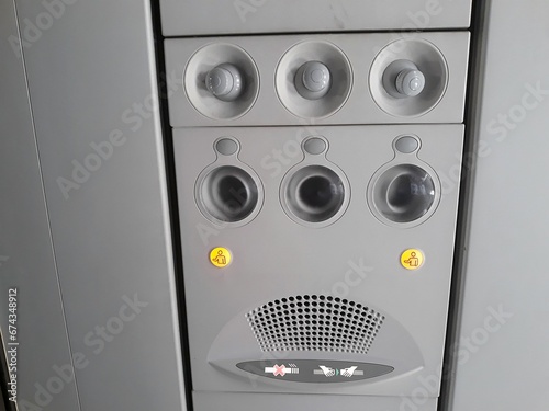 selective focus air conditioner panel on the cabin of a commercial passenger aircraft