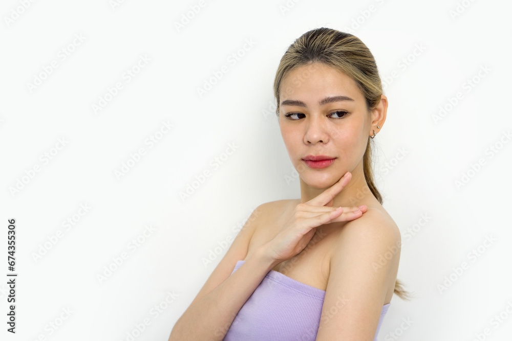 A closeup shot of young woman delicately touching her face, revealing details of her fingers, nails, and facial texture. Her eyes carry an expression of deep contemplation. A closeup shot of young woman delicately touching her face, revealing details of her fingers, nails, and facial texture. Her eyes carry an expression of deep contemplation.