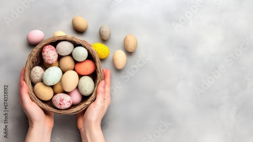 female hands holding basket of colorful pastel eggs on bright background. for Easter day, birthday, mother's day. artwork design. copy text space.