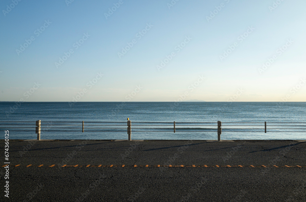 Beach road at twilight with lonely mood. Quiet beach in the evening at Kamakura in Japan. 