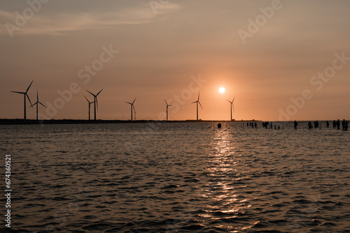 Wind turbine in Gaomei Wetlands at sunset  Taichung  Taiwan