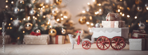 Elegant white gift boxes with golden ribbons are presented in a decorative carriage, set against a glowing Christmas tree adorned with shimmering lights and ornaments.