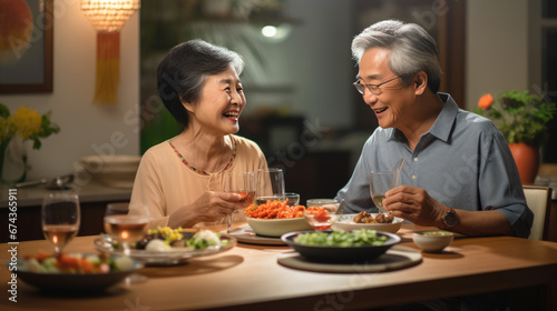 An elderly couple shares a joyful dinner at home  laughing and bonding over candlelit delicacies and wine.