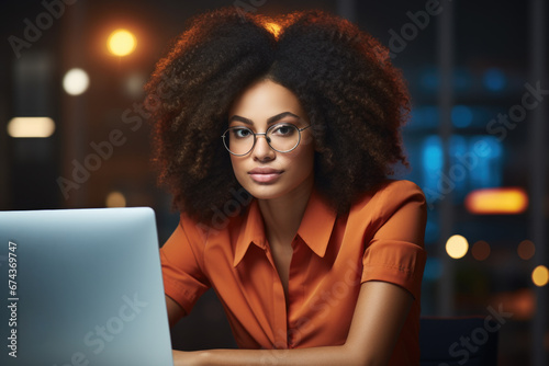 Woman sitting at table with laptop computer. This image can be used to depict remote work, online learning, or technology in daily life.