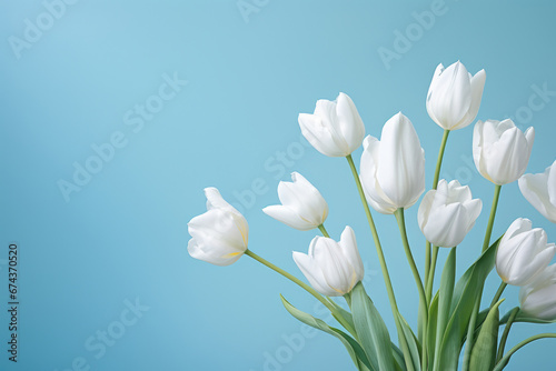 Beautiful arrangement of white tulips in vase. Perfect for adding touch of elegance to any space.