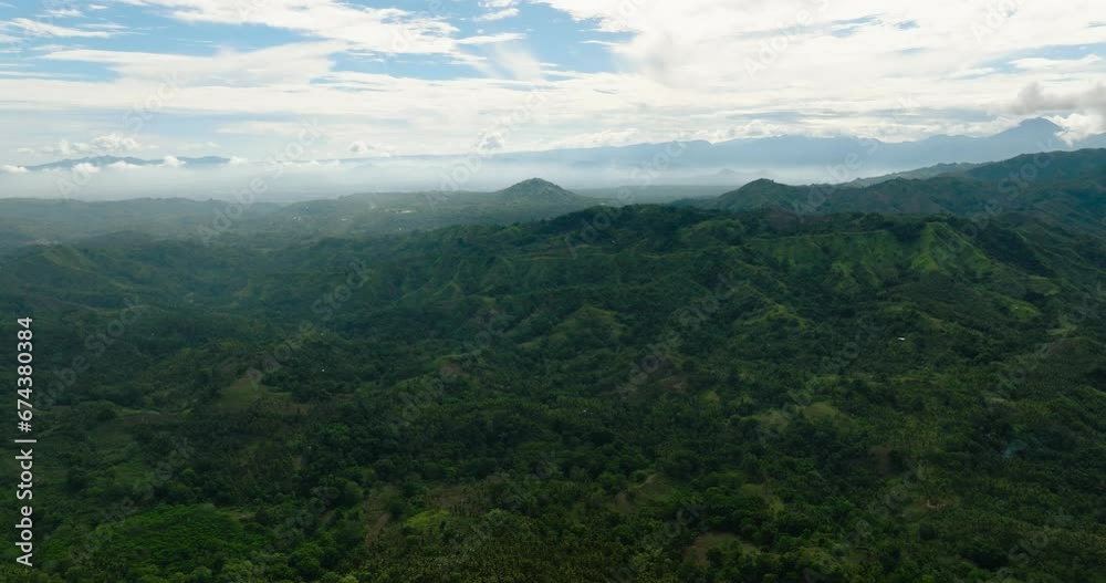 Fresh green foliage, tropical plants and trees covers mountains and ravine. Mindanao, Philippines. Fresh green foliage, tropical plants and trees covers mountains and ravine. Mindanao, Philippines.