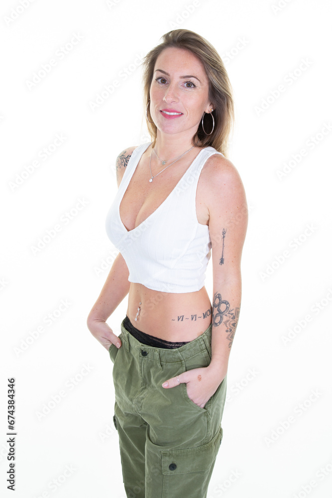 Pretty young slim blonde woman in summer clothes on white background stands with hands on hips pocket girl trousers Pretty young slim blonde woman in summer clothes on white background stands with hands on hips pocket girl trousers