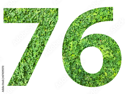 The shape of the number 76 is made of green grass isolated on transparent background. Go green concept.